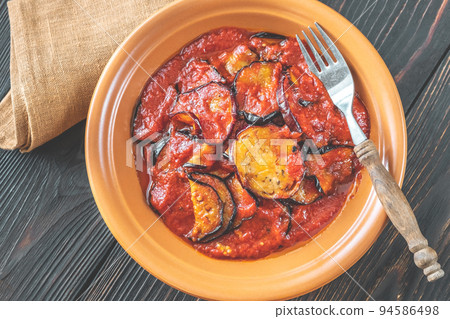 Fried eggplant with tomato sauce 94586498