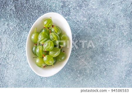 Bowl of gooseberries 94586583