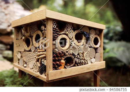 Insect hotel. Bugs and bees hotel. Woodhouse with compartments 94586735