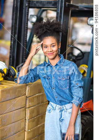 African American worker working in warehouse. 94586808