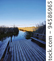 View of a wooden pier on a large crayfish lake. State Natural Reserve Cancer Lakes, St. Petersburg. 94586965