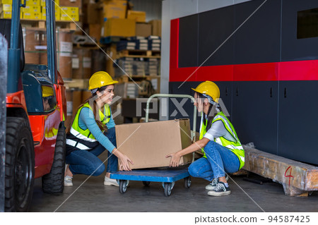 woman worker working in warehouse.  94587425