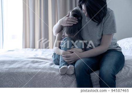 Loving young mother touching upset little daughter, expressing support, young mum comforting offended adorable preschool girl, showing love and care 94587465