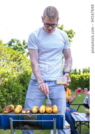 Family enjoy backyard barbecues party. People hanging out at home party. Family enjoy backyard barbecues party. People hanging out at home party. 94587698