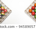 Easter eggs of different colors. Preparing for Easter Week. 94589057