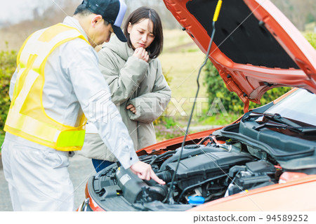 Female driver who called road service due to car breakdown 94589252