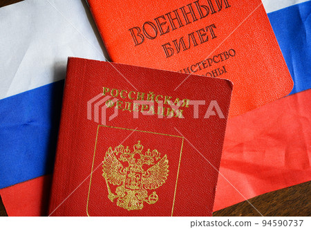Russian passport, Certificate of Russia serviceman and flag on table, top view Russian passport, Certificate of Russia serviceman and flag on table, top view 94590737
