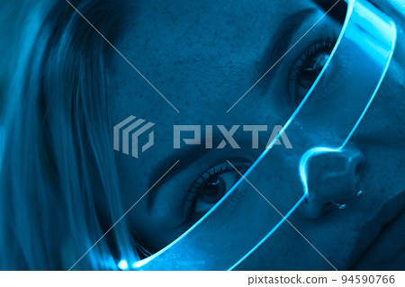 Young woman in neon glasses. Cyberpunk style. Young woman in neon glasses. Cyberpunk style. 94590766