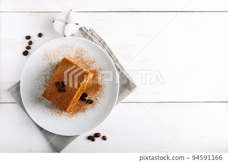 Traditional Italian dessert tiramisu on light background. 94591166