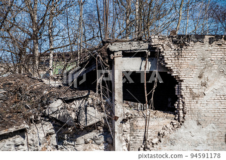 Destroyed building. Break in a brick wall. Demolition of old house. Destroyed building. Break in a brick wall. Demolition of old house. 94591178
