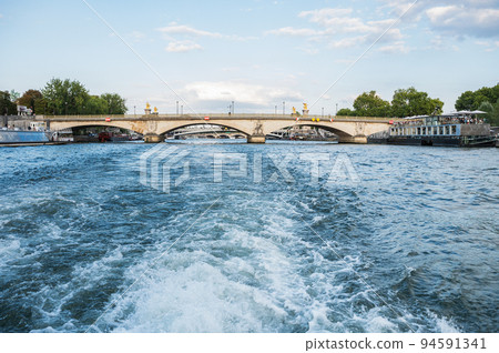 Pont des Invalides, the lowest bridge over Seine. Bridges of Paris, France. View from the boat, evening light 94591341