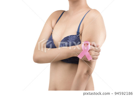A woman in a blue bra shows a pink awareness ribbon A woman in a blue bra shows a pink awareness ribbon 94592186