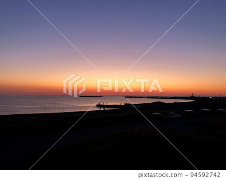 Dawn in the Sea of Okhotsk, Hokkaido and people enjoying salmon fishing Dawn in the Sea of Okhotsk, Hokkaido and people enjoying salmon fishing 94592742