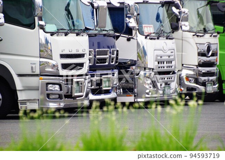 Business image A truck parked in a parking lot Business image A truck parked in a parking lot 94593719