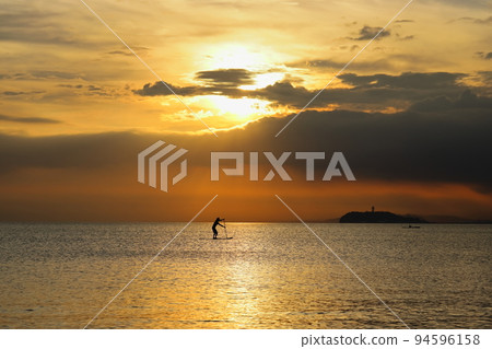 Zushi Beach in summer, young people enjoying SUP in the twilight 94596158