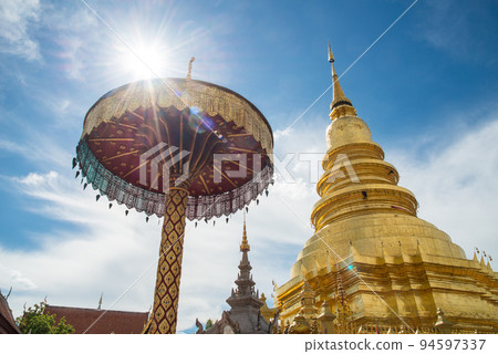 Wat Phra That Hariphunchai the iconic famous temple in Lamphun city, Northern Thailand. Wat Phra That Hariphunchai the iconic famous temple in Lamphun city, Northern Thailand. 94597337