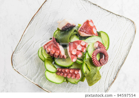 Vinegared food with octopus and cucumber Vinegared food with octopus and cucumber 94597554