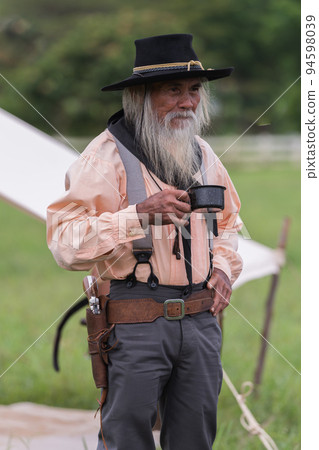 Portrait cowboys post drinking in camping background. Portrait cowboys post drinking in camping background. 94598039