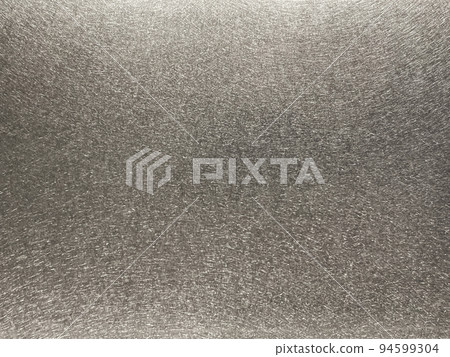 Background image of a metal plate with a lead-colored matte vibration-polished finish 94599304