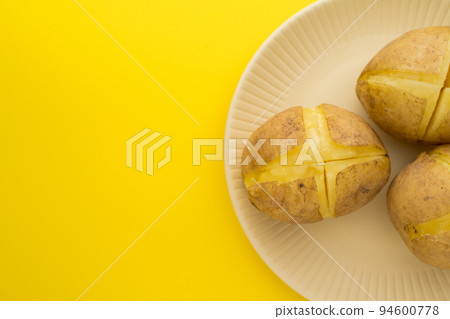 Steamed sweet potato served on a plate, copy space Steamed sweet potato served on a plate, copy space 94600778
