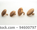 Side-by-side shiitake mushrooms (white background) copy space 94600797