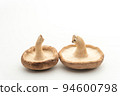 Shiitake mushrooms turned over (white back) copy space 94600798