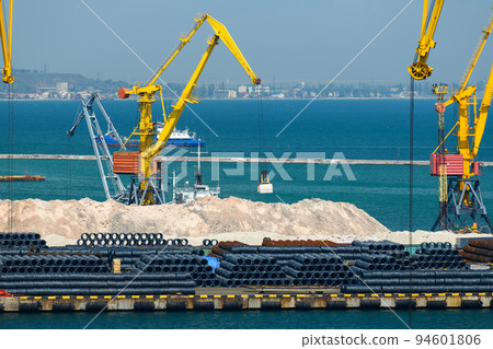 industrial seaport infrastructure, sea, cranes and minerals, metal and bundles of wire, the concept of marine cargo transportation industrial seaport infrastructure, sea, cranes and minerals, metal and bundles of wire, the concept of marine cargo transportation 94601806