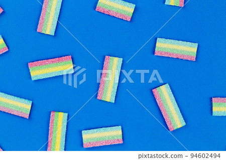 Licorice Candy. Sweet gummy sticks with different flavor, on blue background. Licorice Candy. Sweet gummy sticks with different flavor, on blue background. 94602494