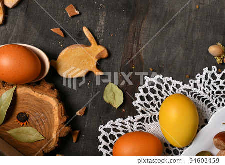 easter holiday still life and decorations, easter eggs, cookies in the shape of rabbit and heart on dark wooden background, blank space for text easter holiday still life and decorations, easter eggs, cookies in the shape of rabbit and heart on dark wooden background, blank space for text 94603459