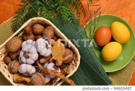 easter eggs and other decoration on a red wooden background, holiday still life easter eggs and other decoration on a red wooden background, holiday still life 94603487
