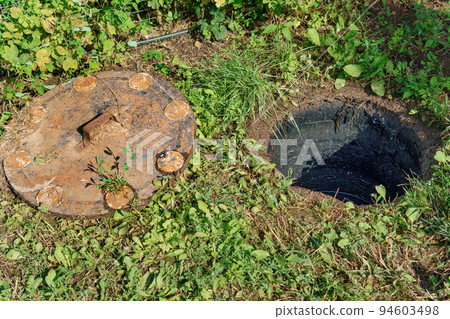 sewer cesspool in a private house, open lid for revision 94603498