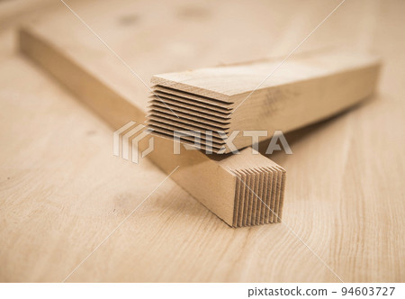 two bars that will be glued together to make a wooden shield 94603727