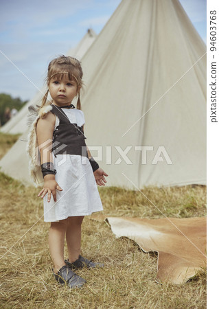 Charming child child in primitive clothes at the viking festival Charming child child in primitive clothes at the viking festival 94603768