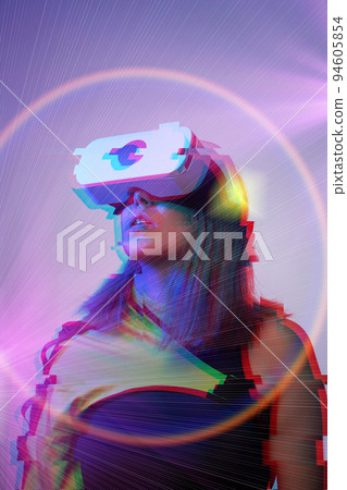 Woman is using virtual reality headset. Concept of virtual, augmented and extended reality and metaverse. 94605854