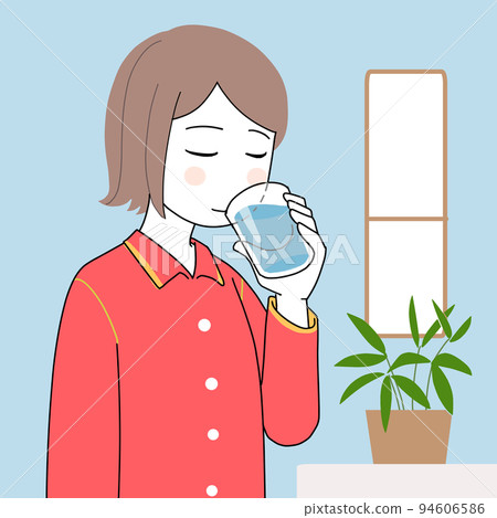 Woman waking up in the morning and drinking water 94606586