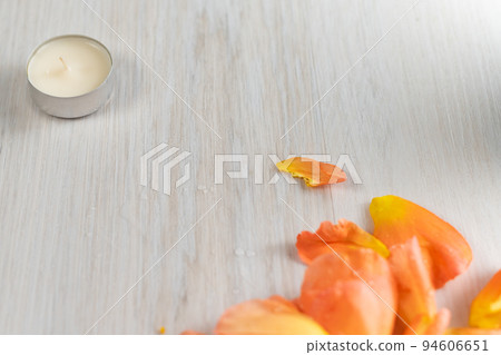 Rose petals and scented candles on the floor. Rose petals and scented candles on the floor. 94606651