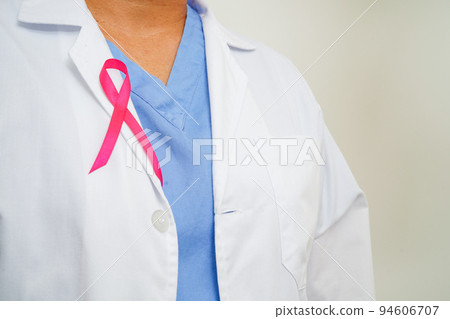 Asian woman doctor with pink ribbon, World Breast Cancer Day at October. Asian woman doctor with pink ribbon, World Breast Cancer Day at October. 94606707