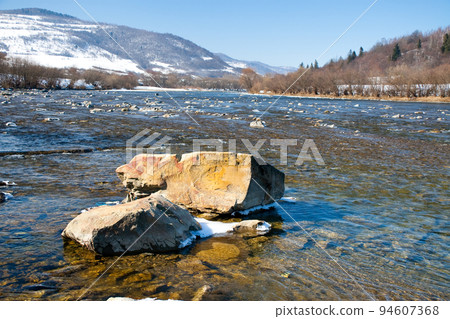 Beautiful landscape of the Carpathian Mountains National Park in Ukraine, with clear water of a wonderful river, blue sky as a copy space. Beautiful landscape of the Carpathian Mountains National Park in Ukraine, with clear water of a wonderful river, blue sky as a copy space. 94607368