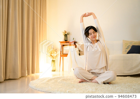 woman stretching before going to bed woman stretching before going to bed 94608473
