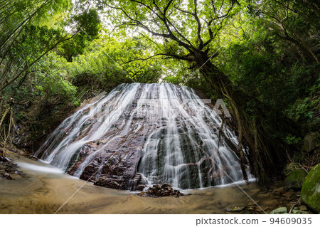 Waterfall shining in fresh green Waterfall shining in fresh green 94609035