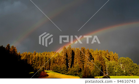 Double rainbow over the forest Double rainbow over the forest 94610743