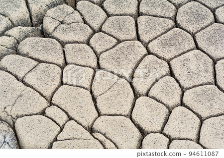 natural stone background, the remains of lava basalt columns form a kind of cobblestone causeway natural stone background, the remains of lava basalt columns form a kind of cobblestone causeway 94611087