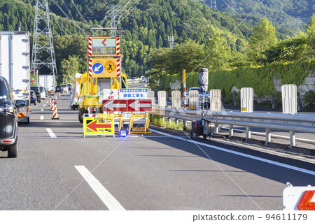 Highway construction traffic jam 94611179