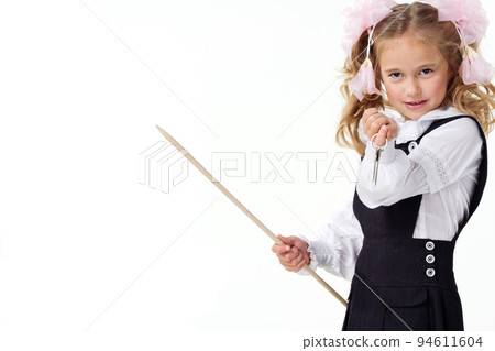 Portrait of a first grader in a school uniform on a white background. 94611604