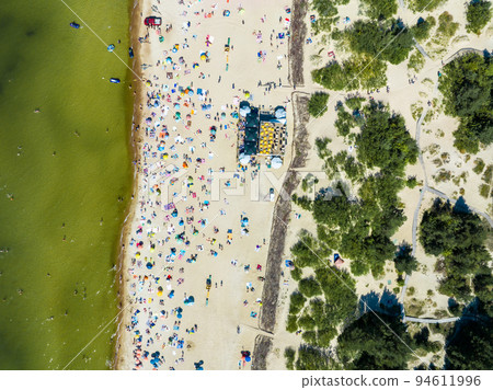 Aerial view of the beach and sea shore in Palanga, Lithuania. Beach town in Palanga. Aerial view of the beach and sea shore in Palanga, Lithuania. Beach town in Palanga. 94611996