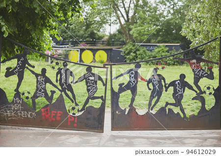 Copenhagen, Denmark, May, 2022: Gate to football field in Christiania Copenhagen, Denmark, May, 2022: Gate to football field in Christiania 94612029