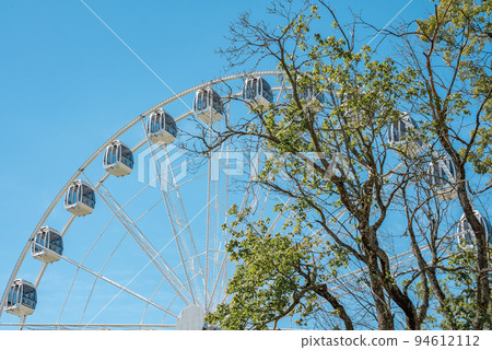 Palanga ferris wheel in Lithuania. Beautiful summer in Palanga. Palanga ferris wheel in Lithuania. Beautiful summer in Palanga. 94612112