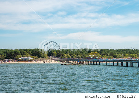 The pier in Palanga. Palanga is a seaside resort town in western Lithuania, on the shore of the Baltic Sea. It is the busiest summer resort in Lithuania The pier in Palanga. Palanga is a seaside resort town in western Lithuania, on the shore of the Baltic Sea. It is the busiest summer resort in Lithuania 94612128