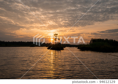 Beautiful morning at the Kemeru Tirelis Swamp in Latvia. Magical sunrise in the morning over the swamp. Latvian nature. Beautiful morning at the Kemeru Tirelis Swamp in Latvia. Magical sunrise in the morning over the swamp. Latvian nature. 94612129