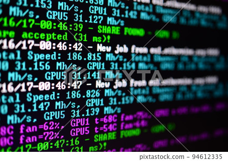 Macro snapshot of the program interface for crypto currency mining on the monitor of an office computer. The concept of mining bitcoins. The flow of information strings and data Macro snapshot of the program interface for crypto currency mining on the monitor of an office computer. The concept of mining bitcoins. The flow of information strings and data 94612335